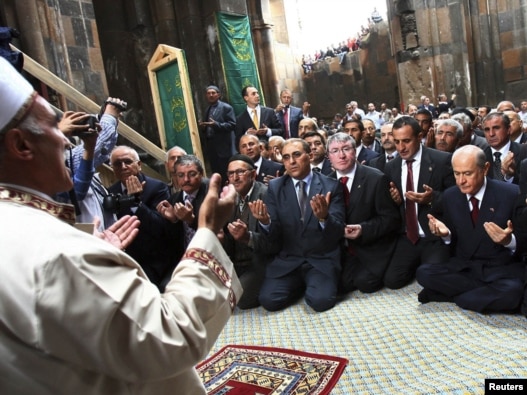 Turkey -- Devlet Bahceli, leader of the Nationalist Movement Party or MHP (R), and provincial party chiefs offer their Friday prayers at an abandoned Armenian church in Ani, 01Oct2010