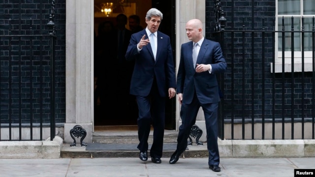 U.S. Secretary of State John Kerry (left) and Britain's Foreign Secretary William Hague leave No. 10 Downing Street in London on February 25.