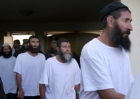 Afghan prisoners arrive in Kabul after their release from the Bagram detention center in February (epa)