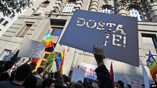 Serbian gay activists display a banner that says "That's enough!" during a protest in front of the government building in Belgrade last year.