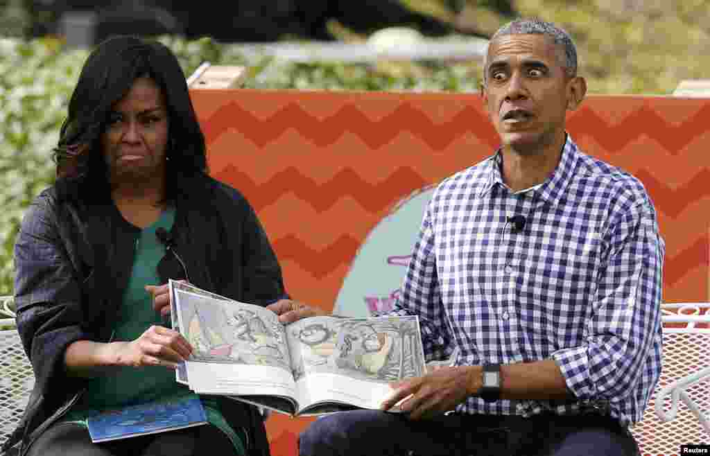 U.S. first lady Michelle Obama (left) and President Barack Obama perform a reading of the book Where the Wild Things Are for children gathered for the annual White House Easter Egg Roll on the South Lawn of the White House in Washington on March 28. (Reuters/Jonathan Ernst)