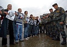 Belarus -- Belarusian members of opposition hold portraits of missing people as Belarus riot policemen block them during a protest rally in Minsk, 16 Sep. 2005