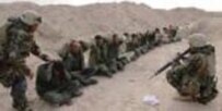 U.S. soldiers with Iraqi prisoners (file photo) (CTK)