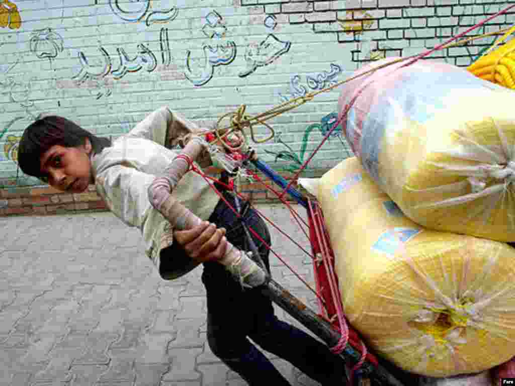 A child porter in the Iranian city of Isfahan