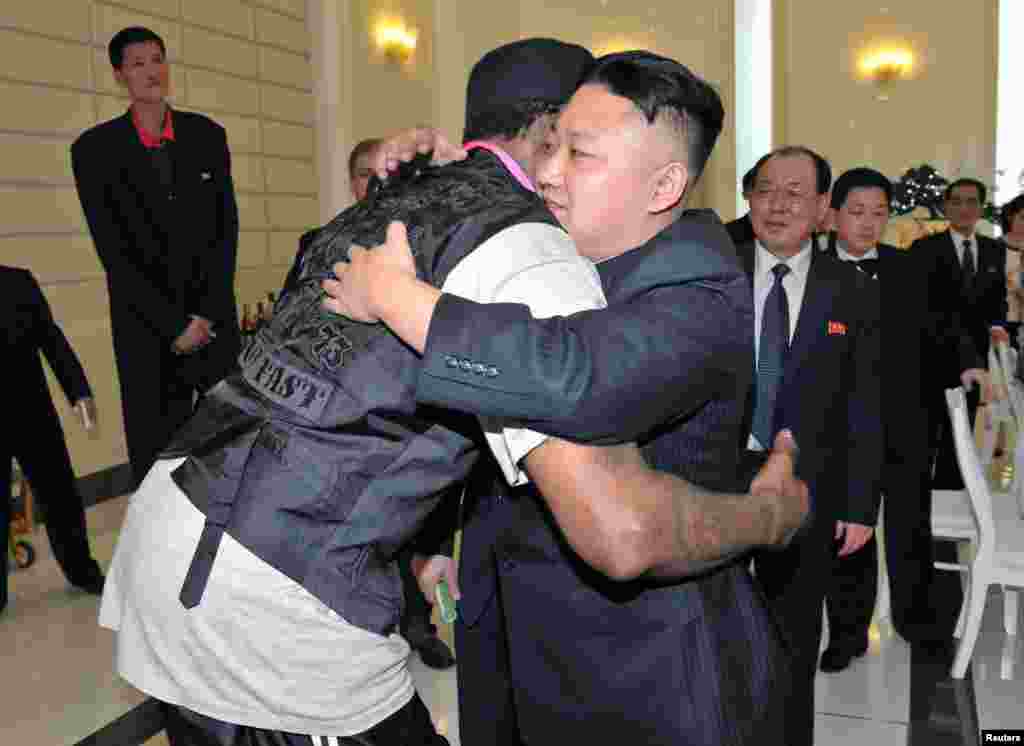 North Korea leader Kim Jong Un and Dennis Rodman hug in Pyongyang during a visit by the former NBA basketball star. (Reuters/KCNA)