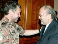 King Abdullah (left) greeting Iranian Foreign Minister Manuchehr Mottaki in Amman in May (epa)