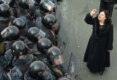 A protester in Armenia urges riot troops not to fire their guns into the crowd.