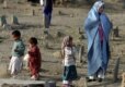 An Afghan widow and her children at the Hazara cemetery in Kabul (epa)