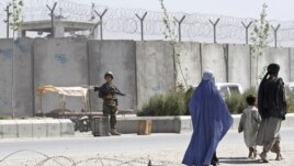 A soldier keeps watch outside Kandahar's main jail.