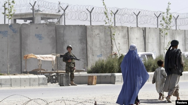 A soldier keeps watch outside Kandahar's main jail.