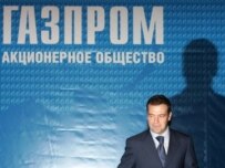 Can presumed President-in-waiting Dmitry Medvedev escape the shadow of Gazprom and other megacorporations? (AFP)