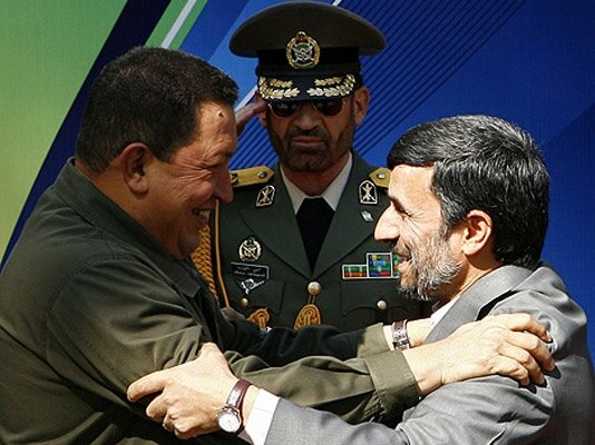 Deadly embrace? Venezuela's Hugo Chavez and Iran's Mahmud Ahmadinejad at a welcoming ceremony in Tehran in April 2009.