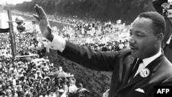Civil rights leader Martin Luther King Jr. waves to supporters from the Lincoln Memorial on the Mall in Washington during the March on Washington on August 28, 1963.