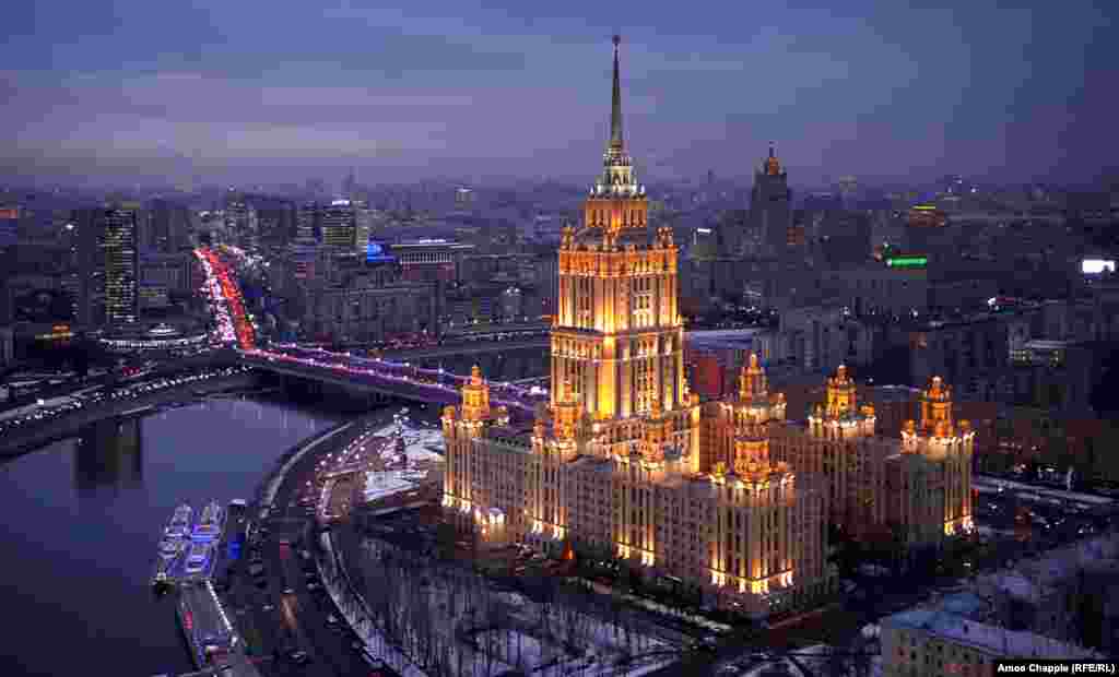 Moscow, Russia. Hotel Ukraina lit up at dusk. The hotel is one of the iconic "Seven Sisters" -- skyscrapers built during Stalin's reign.
