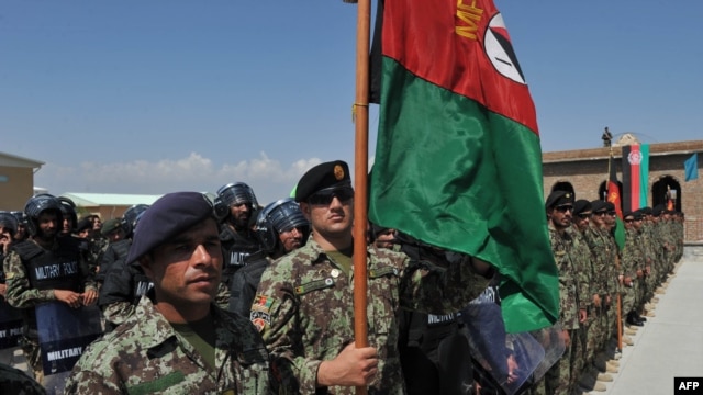 Afghan National Army soldiers stand in formation during a ceremony handing control of Bagram prison over to Afghan authorities. 