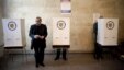 A man holds his ballot at a polling station in Yerevan during parliamentary elections on May 6.