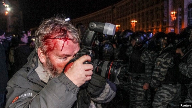 Reuters photographer Gleb Garanich was injured by riot police in the crackdown.