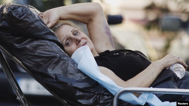 An Israeli survivor is carried on a stretcher to an ambulance as she leaves a hospital in the city of Burgas on July 19, one day after the bomb attack on a bus full of tourists.