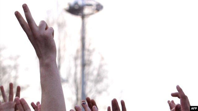 Protesters gesture during a rally near the government building in Chisinau on April 8.