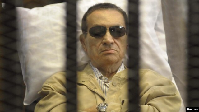 Former President Hosni Mubarak sits inside a cage in a courtroom in Cairo during sentencing on June 2.  
