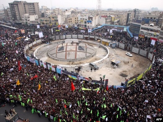 The monument was still under construction in this photo of a pro-government rally at Revolution Square in December 2009.