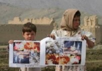 Afghan children last week hold posters in a UN bird-flu prevention campaign (epa)