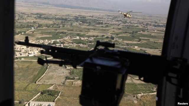 A Taliban spokesman claimed the helicopter was shot down by rocket fire and burst into flames.