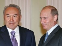 Navarbaev (left) and Putin in Moscow on March 19 (ITAR-TASS)