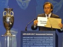 UEFA President Michel Platini announcing Poland and Ukraine's win (AFP)