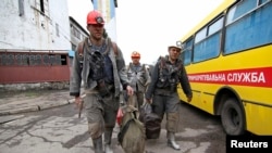 Employees walk near the Skochynskyy Mine outside Donetsk on April 11.