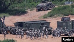 Ежегодные военные учения США и Южной Кореи рядом с демилитаризованной зоной, разделяющей две Кореи. Пхаджу, 22 августа 2016 года.