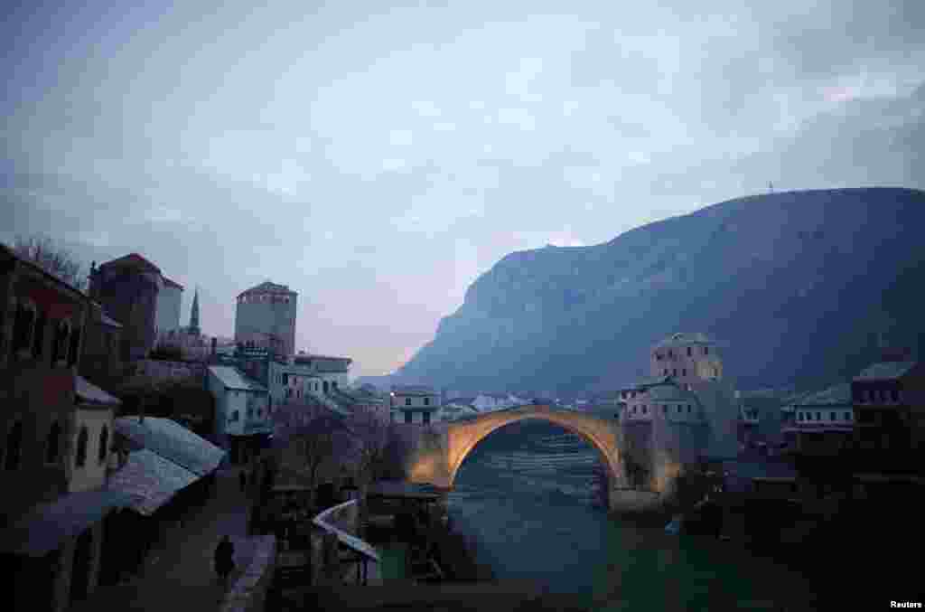 Mostar's old stone bridge over the Neretva River was destroyed in 1993 but rebuilt after the end of Bosnia's civil war in a move toward reconciliation.