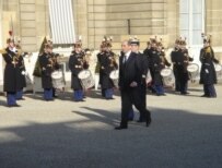 Armenian President Robert Kocharian arriving for talks with Azeri President Ilham Aliyev in Paris in February (RFE/RL)