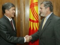 Boucher (right) with Kyrgyz Prime Minister Almazbek Atambaev on June 8 (AFP)