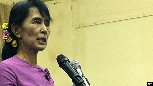 Aung San Suu Kyi speaks at a meeting inside the National League For Democracy party headquarters in Yangon on November 18.