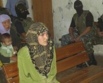 Dilnoza Nishanbaeva, one of the six alleged militants on trial, pictured in court on August 30 (RFE/RL)