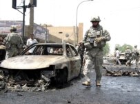 The site of a car bombing in Baghdad's Karrada district today (epa)