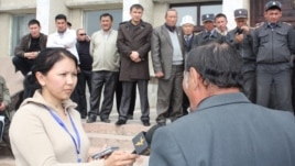 Radio Azattyk correspondent Zamira Kojobaeva (left, with microphone) interviewing protesters as the second Kyrgyz Revolution begins on April 6, 2010 with unrest in the western Kyrgyzstan city of Talas.