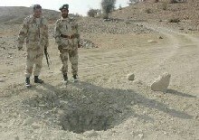 Pakistan - Security - Pakistani paramilitary soldiers guard the site of a landmine blast planted by alleged Baluchi nationalist, as they patrol in the restive Dera Bugti region of Baluchistan, 3 Jan. 2006