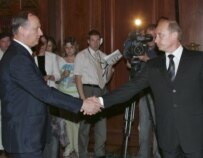 Putin (right) shakes hands with FSB head Patrushev in Moscow today (epa)