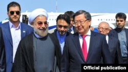 Iranian President Hassan Rohani (front left) and Kyrgyz Prime Minister Jantoro Satybaldiev (front right) ahead of a Bishkek summit