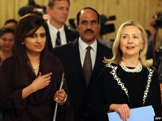 U.S. Secretary of State Hillary Clinton (far right) with Pakistan's Foreign Minister Hina Rabbani Khar (far left) in Islamabad. 