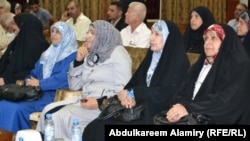Iraqi women activists and legislators gather for a conference on women's empowerment in Basra in September. The new law seeks to compensate for some of the obstacles women face in getting work in Iraq today.