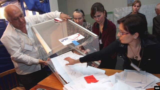 Local election commission members opening a ballot box at a polling station in Tbilisi after May 2008 voting.