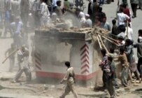 Protesters destroy police check post during riot in Kabul on May 29 (epa)