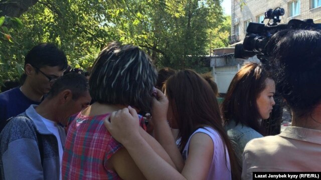 People gather outside the site of the fire in northeast Moscow.