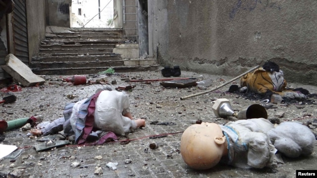 Toys are seen among the rubble of damaged shops in the war-ravaged Syrian city of Aleppo.