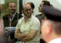 Imad Eddin Barakat Yarkas (center) listens to a judge handing down his 27-year jail sentence