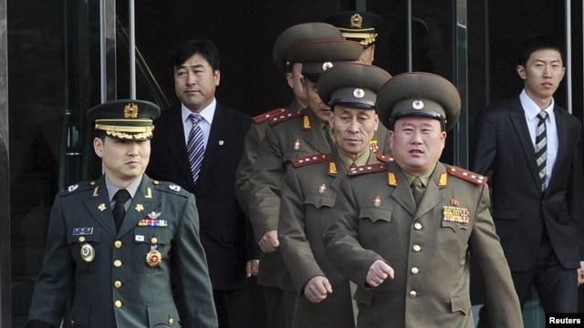 North Korean Colonel Ri Son-kwon (front right) led talks for the North in the village of Panmunjom. 