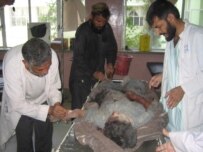 A man injured in the air strikes receives treatment in Kandahar (epa)